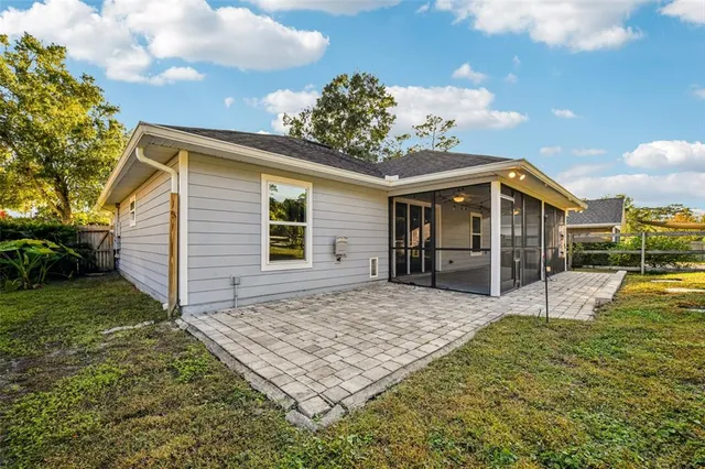 a view of a house with table and chairs