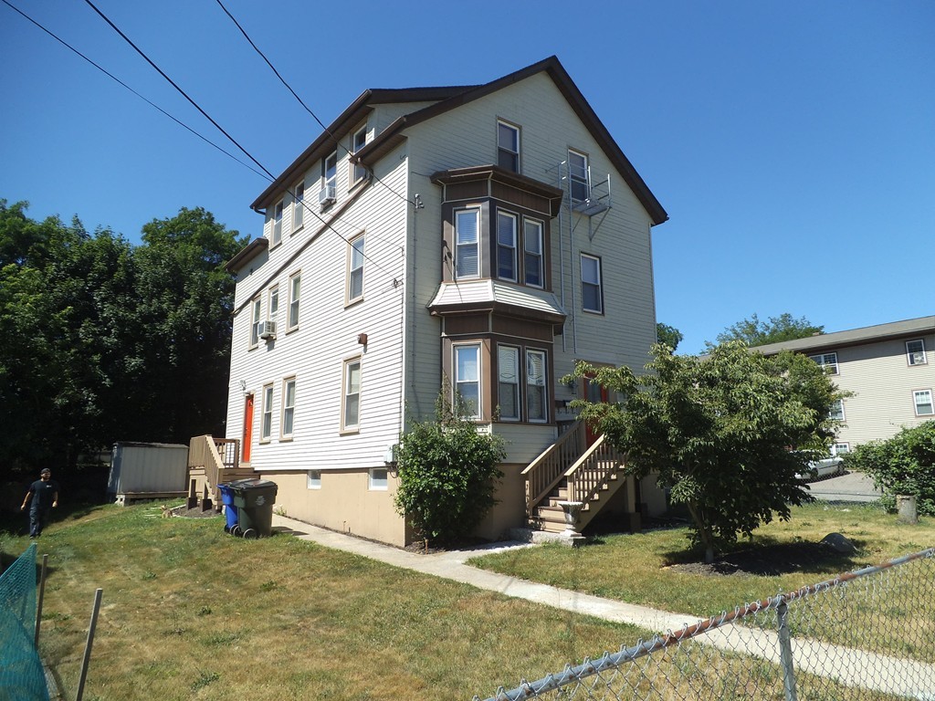 549 Buffinton Street Fall River, MA 02721 - Photo 1 of 17 a view of a house with yard and plants