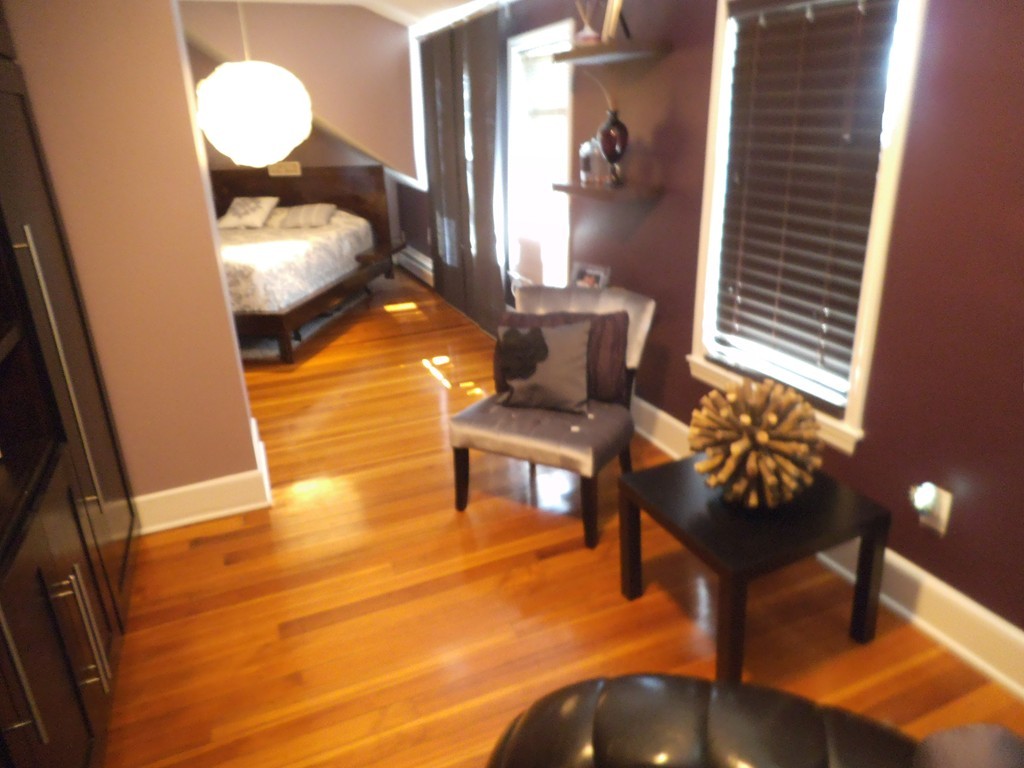 549 Buffinton Street Fall River, MA 02721 - Photo 14 of 17 a view of a livingroom with furniture and stairs