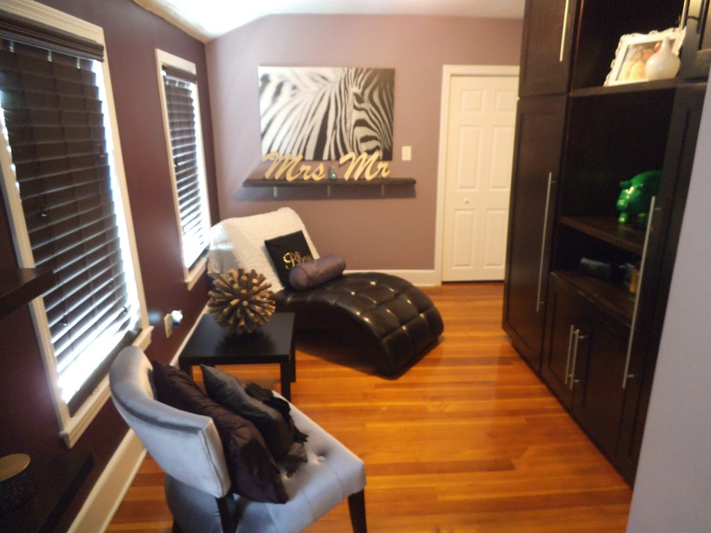 549 Buffinton Street Fall River, MA 02721 - Photo 16 of 17 a bedroom with a bed and a mirror on the dresser