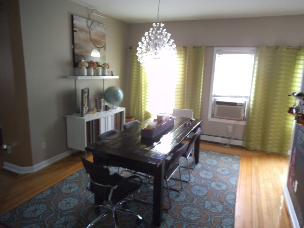 549 Buffinton Street Fall River, MA 02721 - Photo 17 of 17 a view of a dining room with furniture and a chandelier