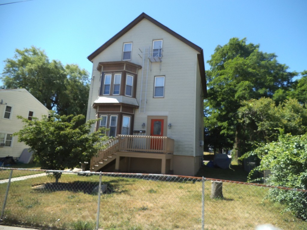 549 Buffinton Street Fall River, MA 02721 - Photo 2 of 17 a front view of a house with a yard
