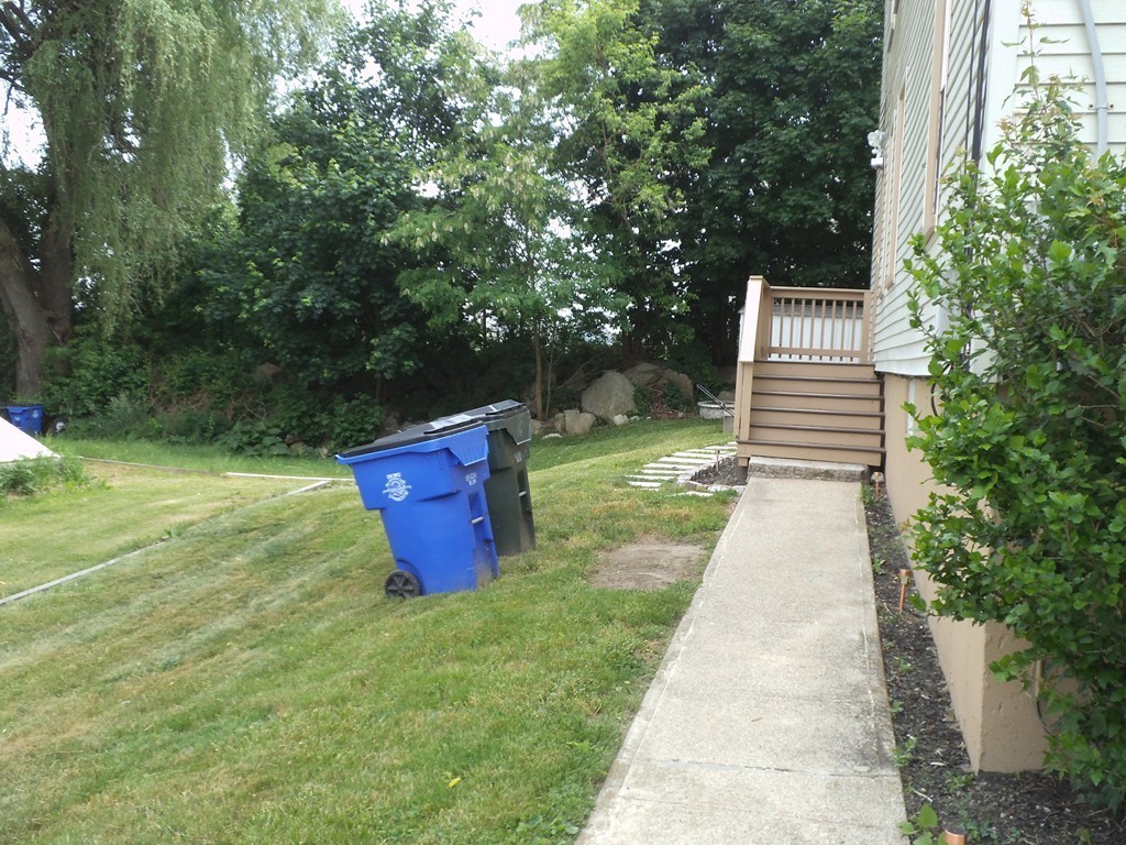 549 Buffinton Street Fall River, MA 02721 - Photo 5 of 17 a backyard of a house with lots of green space