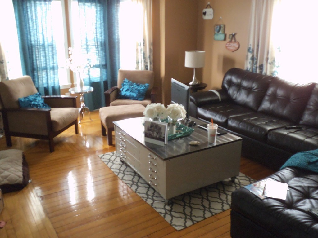 549 Buffinton Street Fall River, MA 02721 - Photo 6 of 17 a living room with furniture and a large window
