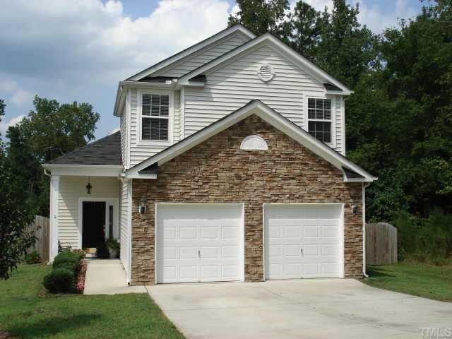 4009 Iverson Street Raleigh, NC 27604 - Photo 1 of 1 a front view of a house with a yard and garage