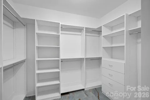 a close view of a sink a mirror and vanity