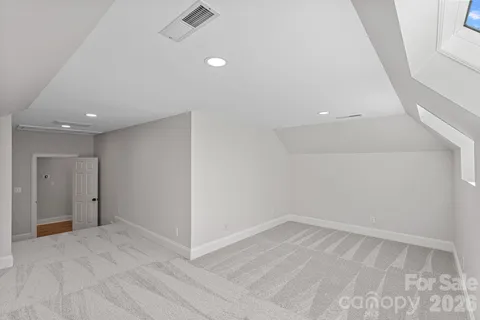 a living room with fireplace furniture and a large window