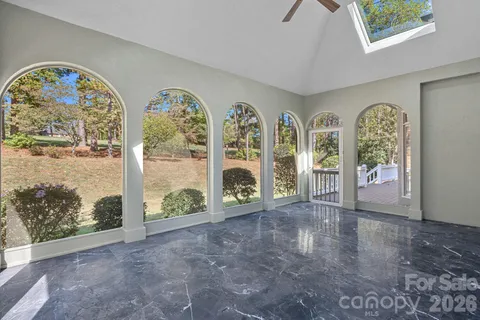 a view of a wooden deck with a yard