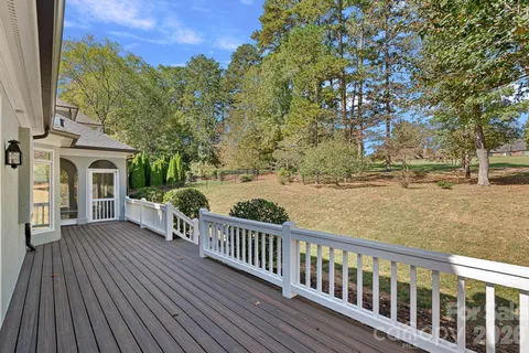 a view of a house with a tree in the yard