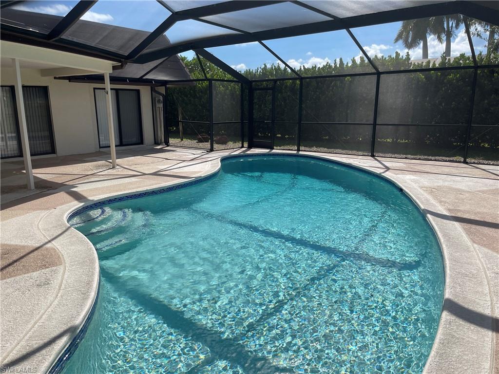 255 Pine Valley Circle Naples, FL 34113 - Photo 18 of 27 a swimming pool with a patio