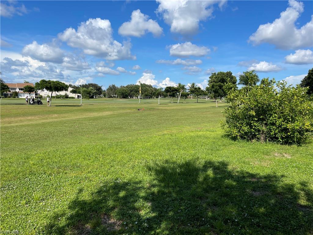 255 Pine Valley Circle Naples, FL 34113 - Photo 23 of 27 a view of building with outdoor space