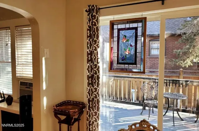 a front view of a house with outdoor seating