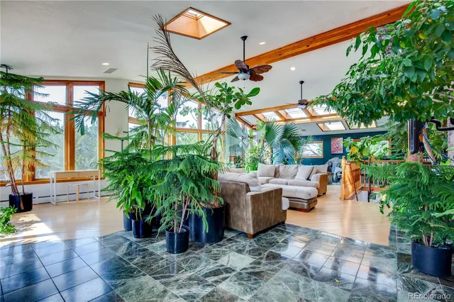 an outdoor space with patio furniture and potted plants