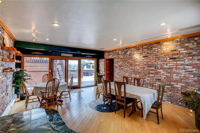 a living room with furniture and floor to ceiling window