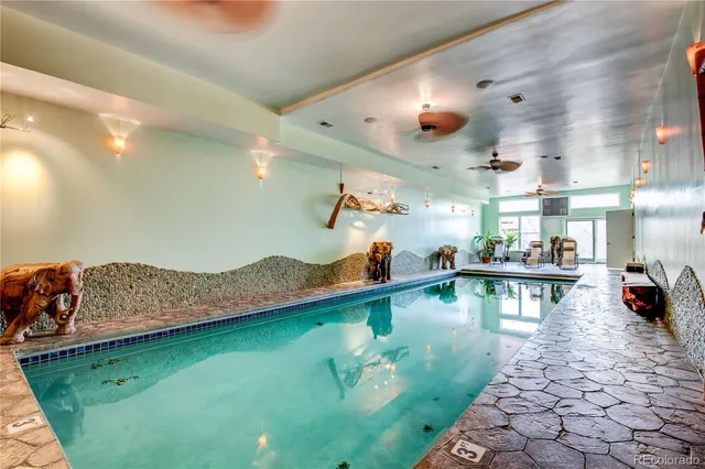 a view of swimming pool with outdoor seating