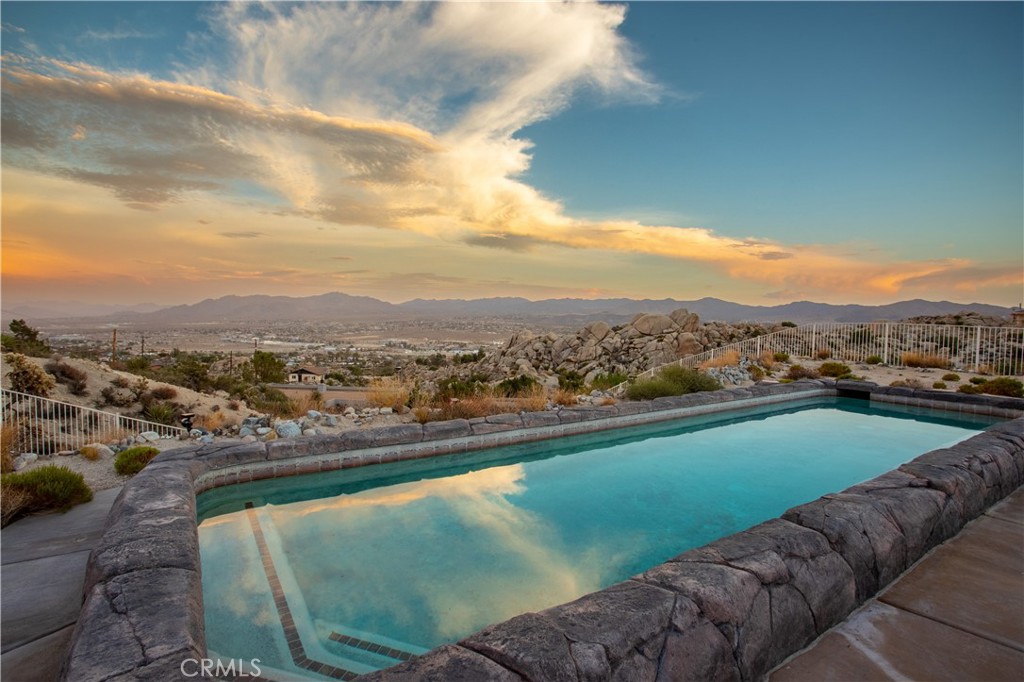 6185 Mirlo Road Yucca Valley, CA 92284 - Photo 1 of 1 a view of a city from a terrace