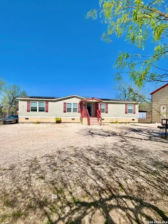 a view of swimming pool with an outdoor seating