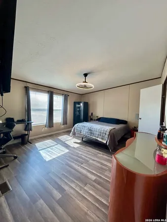 a bedroom with furniture and a chandelier