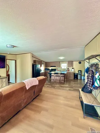 a living room with furniture and a table