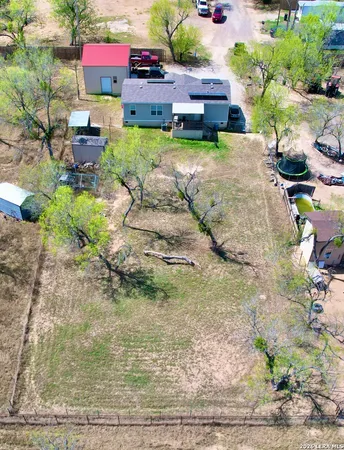 a aerial view of a house with a yard