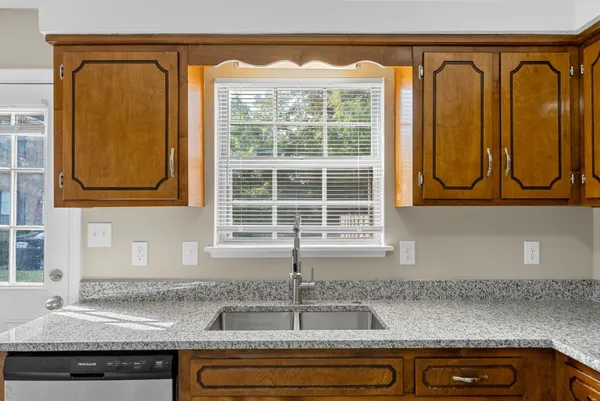 a view of a sink and a window