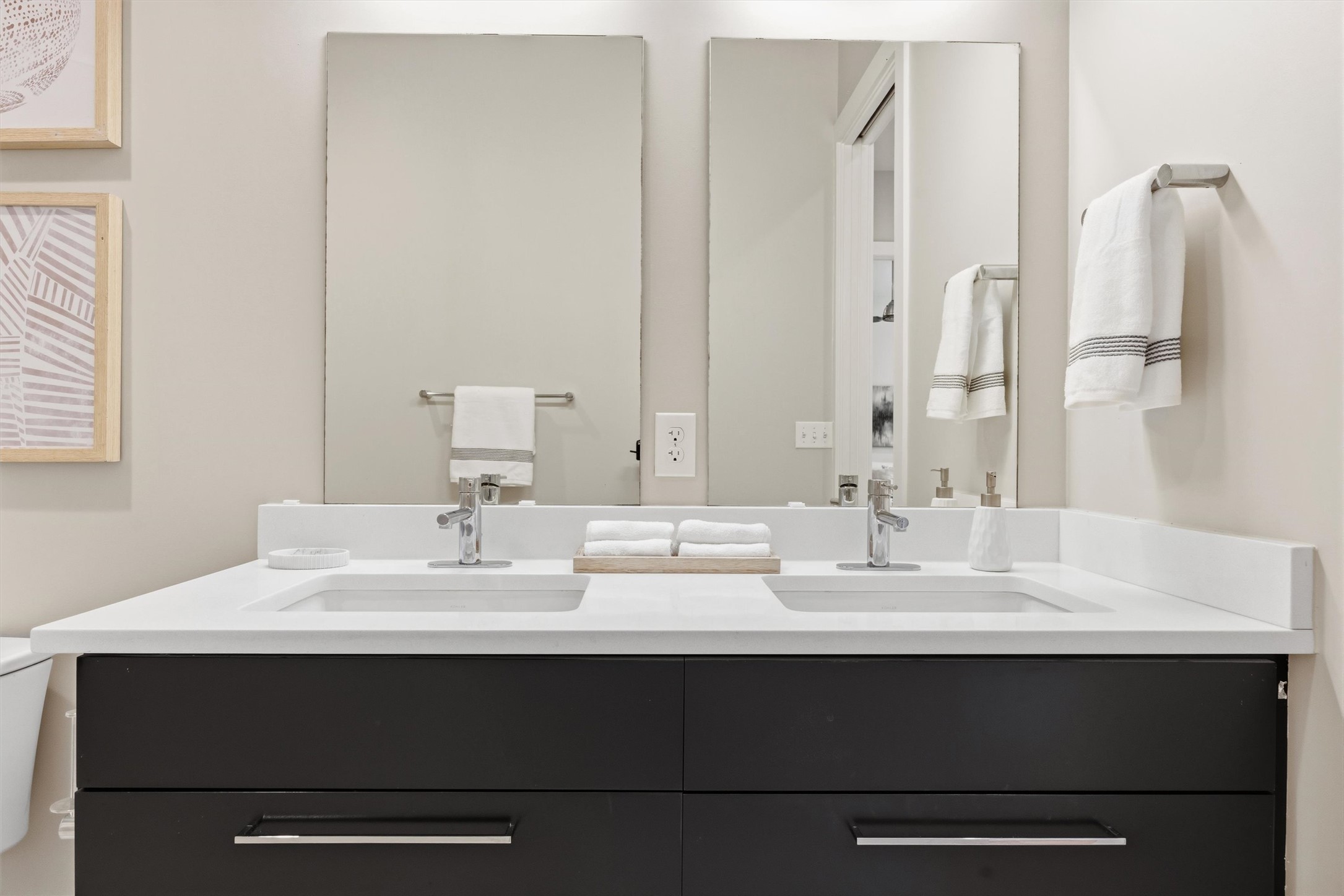 2314 Enfield Road, Unit 203 Austin, TX 78703 - Photo 21 of 37 Dual sinks and oversized mirrors make morning routines effortless.