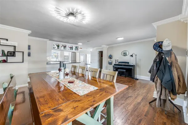 a kitchen with stainless steel appliances granite countertop a stove a sink a refrigerator a microwave a sink and cabinets