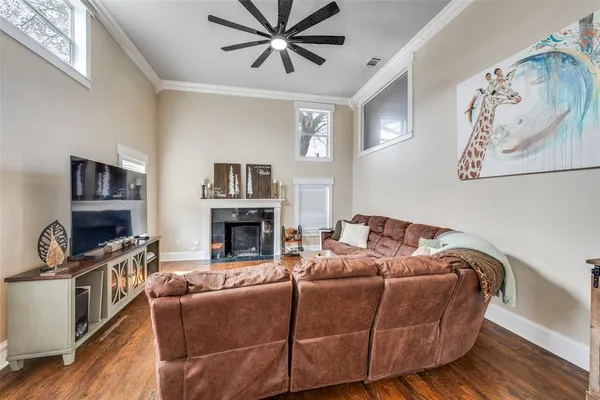 a living room with furniture and a fireplace