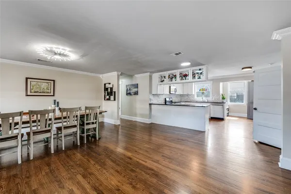 a view of a livingroom with furniture and a flat screen tv
