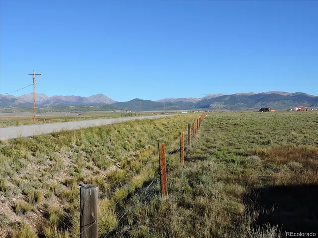 a view of an ocean and a mountain