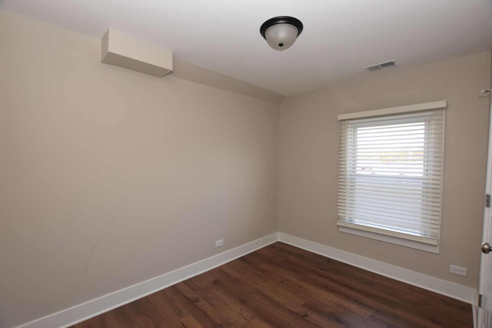 412 Lincoln Avenue, Unit B Fox River Grove, IL 60021 - Photo 13 of 16 wooden floor in an empty room with a window