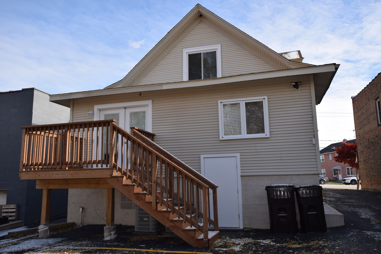 412 Lincoln Avenue, Unit B Fox River Grove, IL 60021 - Photo 2 of 16 a view of a house with wooden stairs