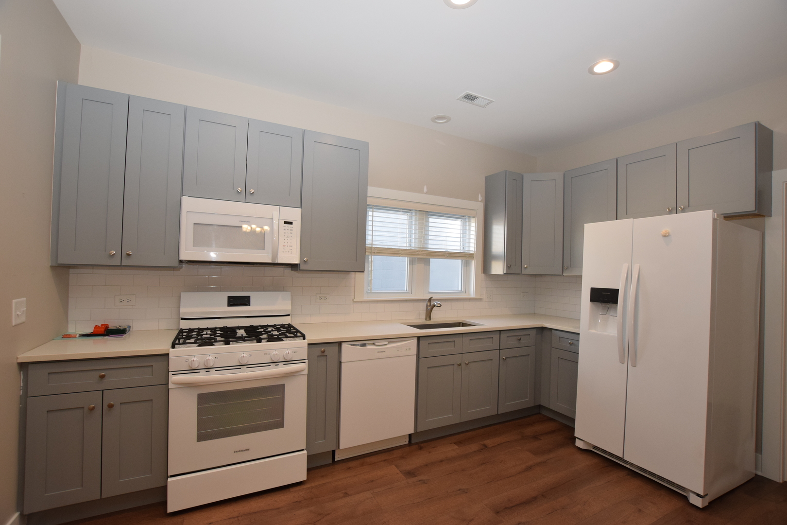 412 Lincoln Avenue, Unit B Fox River Grove, IL 60021 - Photo 5 of 16 a kitchen with cabinets appliances a sink and a window