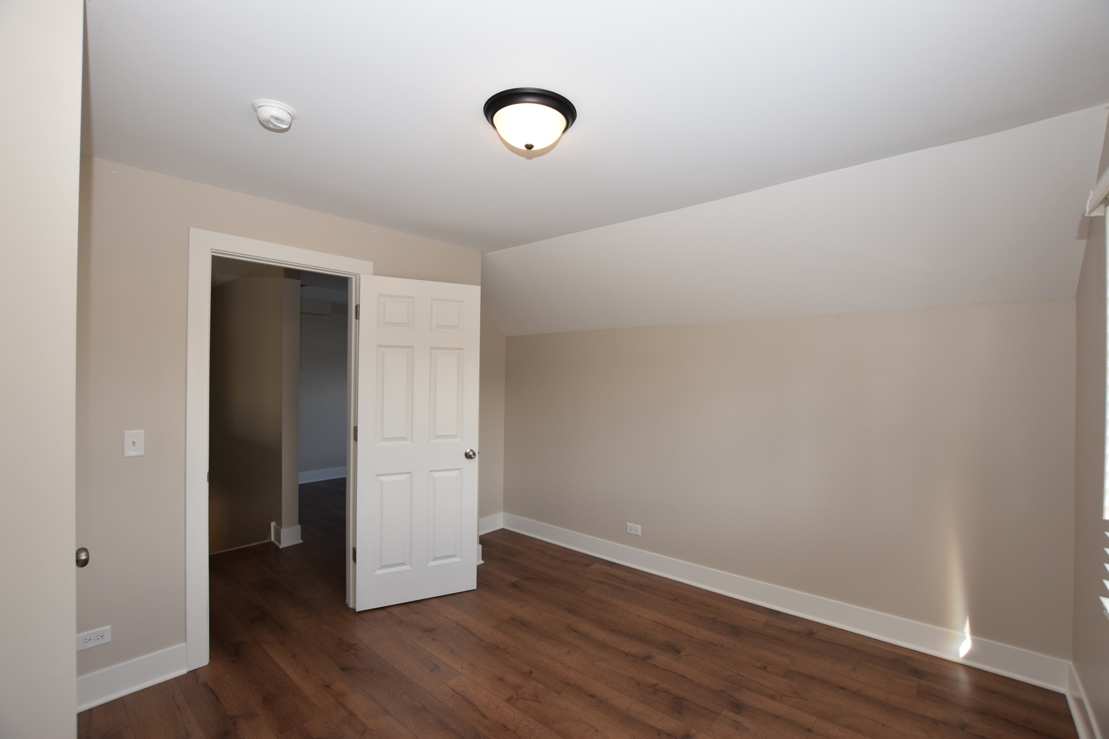 412 Lincoln Avenue, Unit B Fox River Grove, IL 60021 - Photo 9 of 16 a view of an empty room with wooden floor