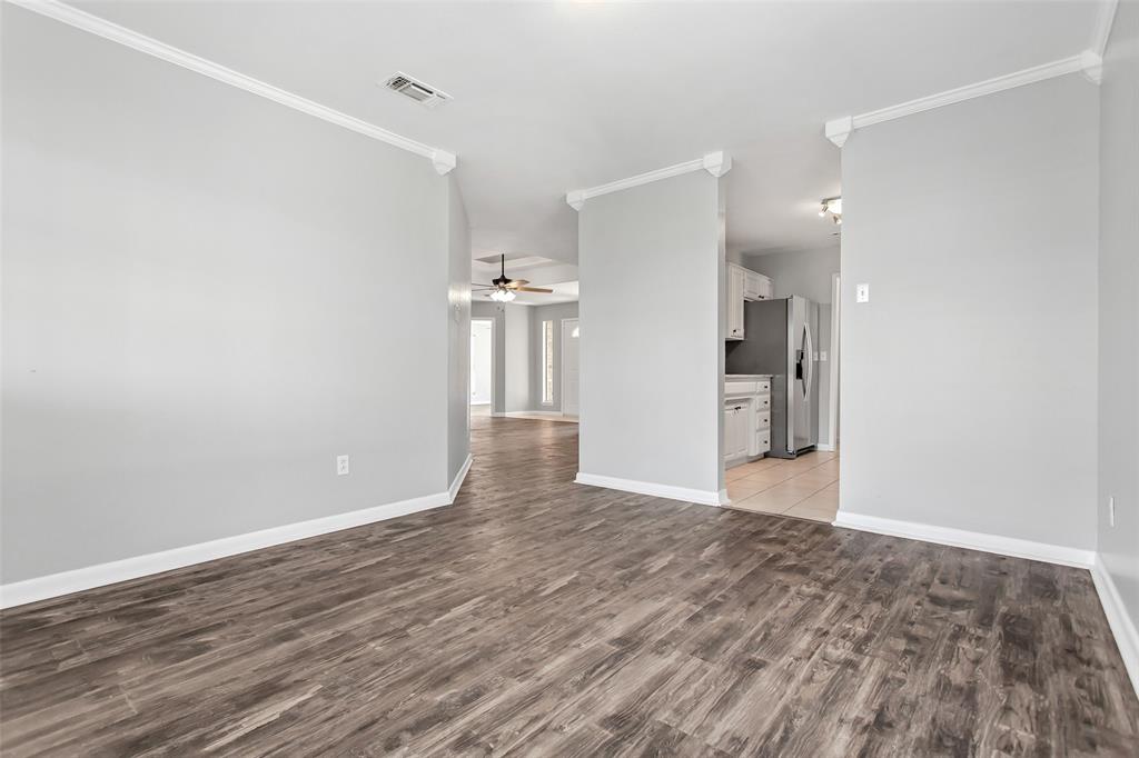 712 Billups Street Van Alstyne, TX 75495 - Photo 13 of 38 a view of empty room with wooden floor