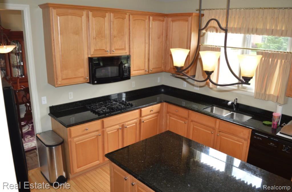 48005 Gladstone Road Canton, MI 48188 - Photo 10 of 62 Spacious kitchen, updated light fixtures, custom window treatments, granite
