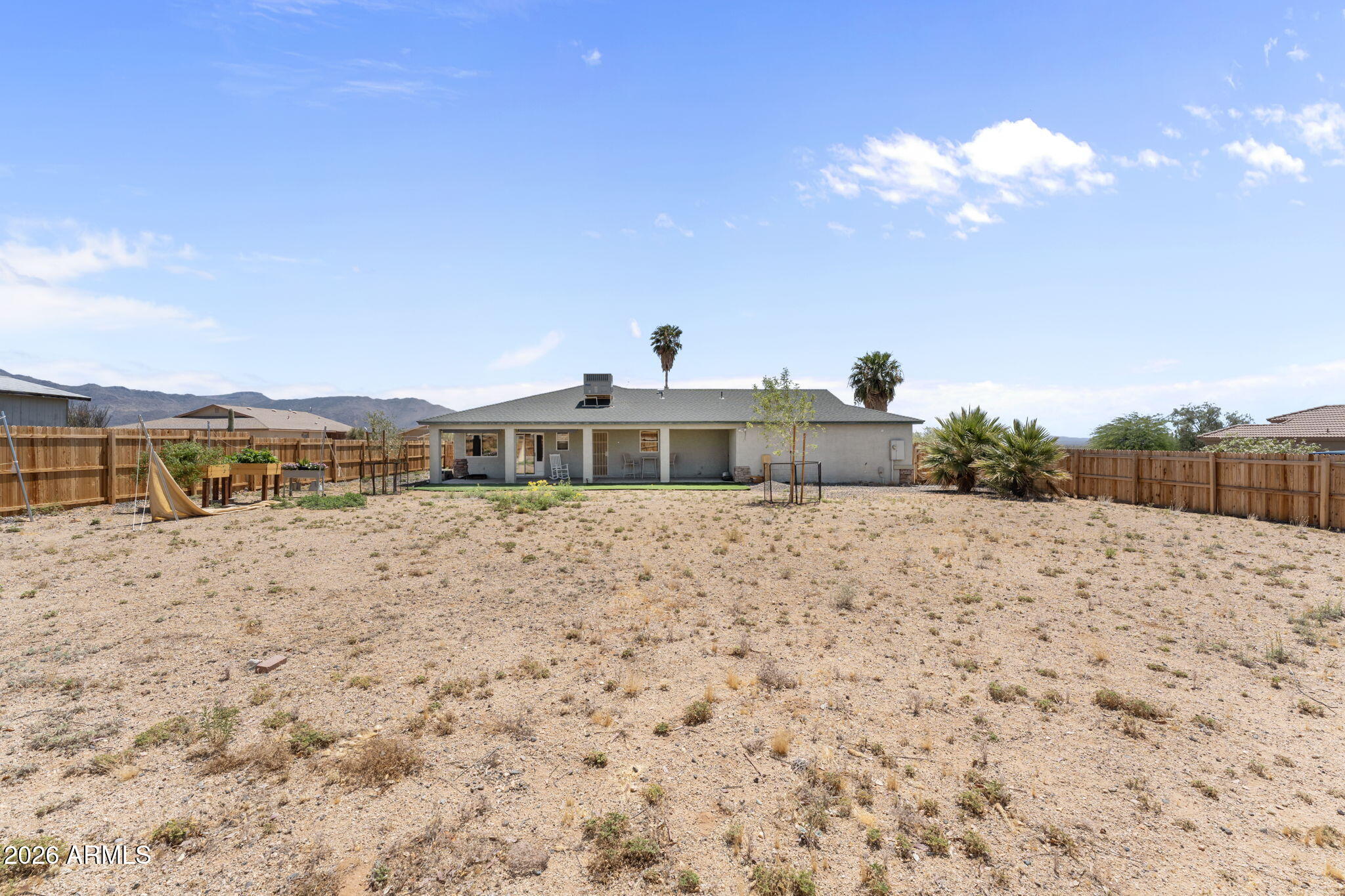 27144 Bennett Way Congress, AZ 85332 - Photo 24 of 33 a front view of a house with a yard