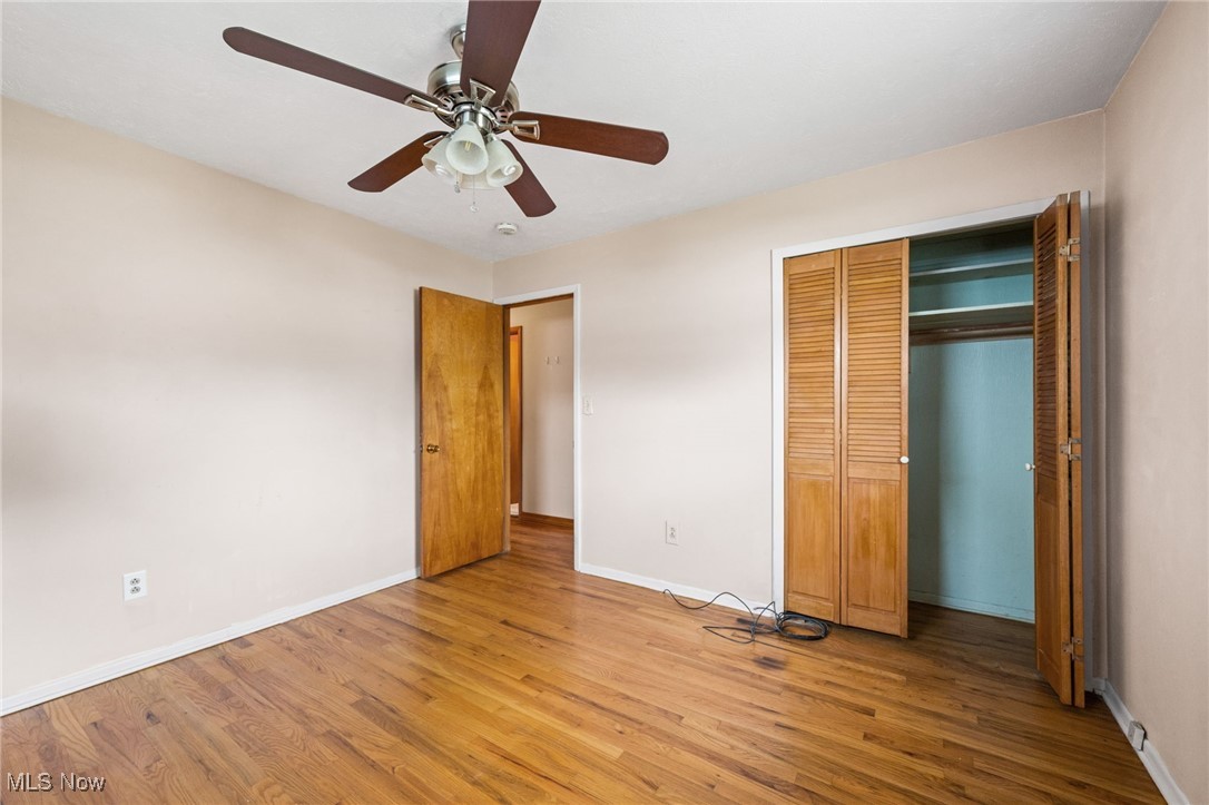 30844 Harrison Road Wickliffe, OH 44092 - Photo 12 of 30 Unfurnished bedroom with style floors, a closet, and a ceiling fan
