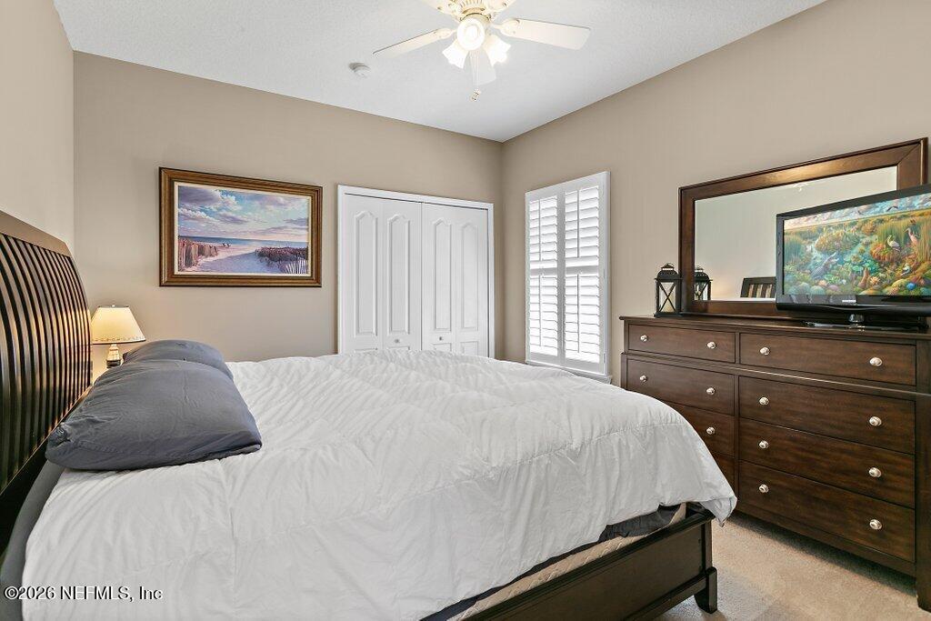 841 Ifield Road St. Augustine, FL 32095 - Photo 31 of 69 a bedroom with a bed and a dresser