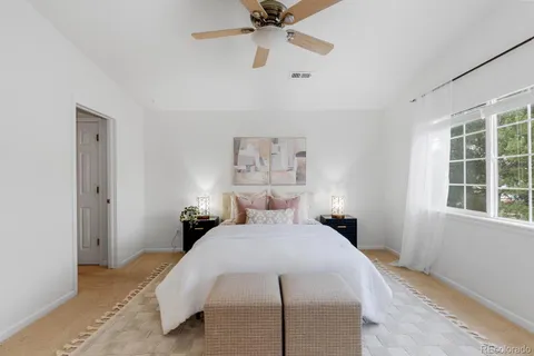 a bedroom with a bed and window