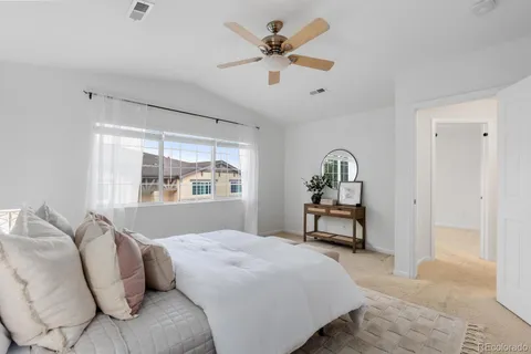 a bedroom with a bed and window