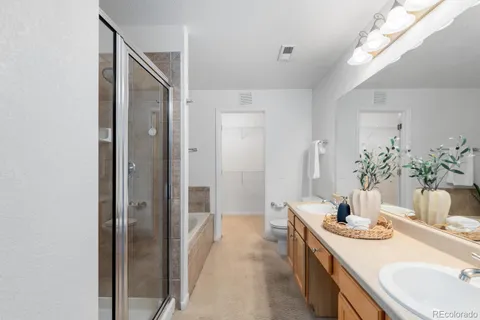 a bathroom with a double vanity sink and mirror