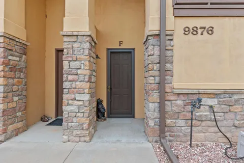 a view of front of house with a yard