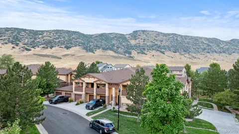 a view of a backyard with plants and lake view
