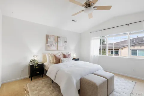 a bed room with a bed and a window