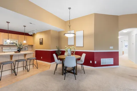 a view of a dining room with furniture