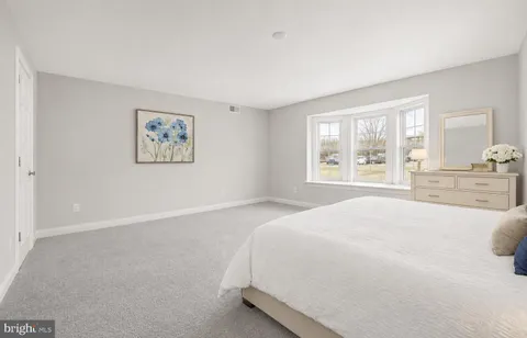 a bedroom with a bed and a cabinets