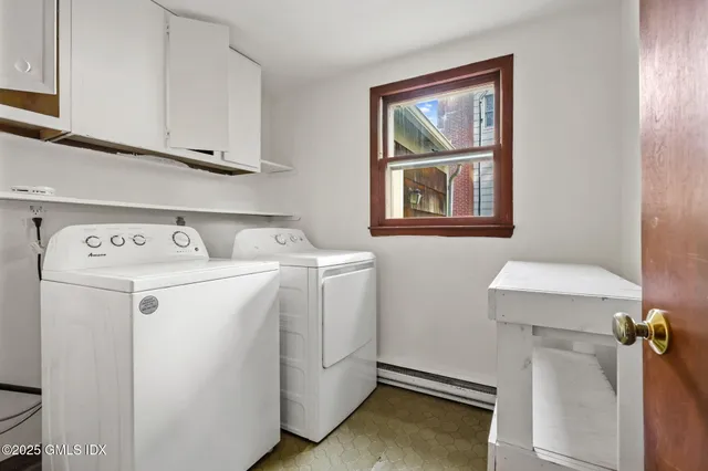 a view of a house with a large tree