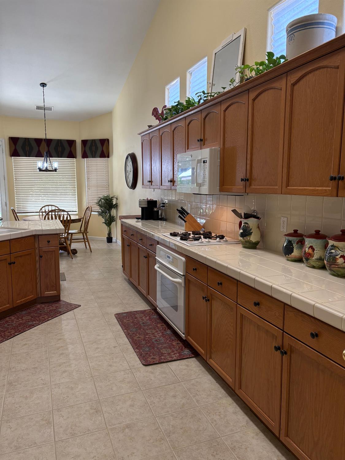 2644 Gibson Avenue Clovis, CA 93611 - Photo 3 of 21 a kitchen with stainless steel appliances granite countertop a sink stove and cabinets