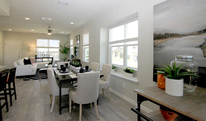 708 Tinton Falls Lane Pflugerville, TX 78660 - Photo 13 of 40 a view of a dining room with furniture and a potted plant